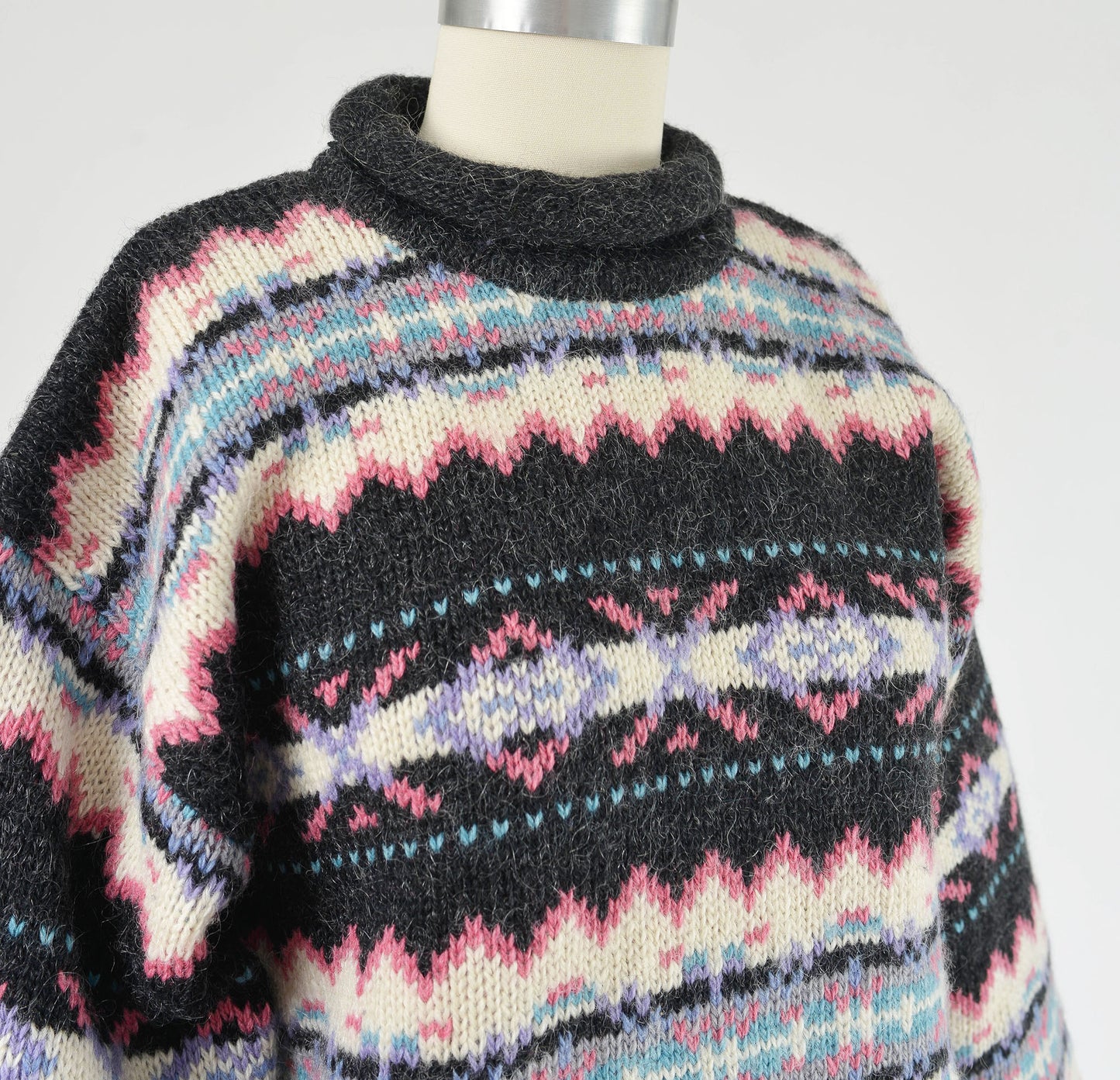 Close up view of neckline on vintage Woolrich sweater.