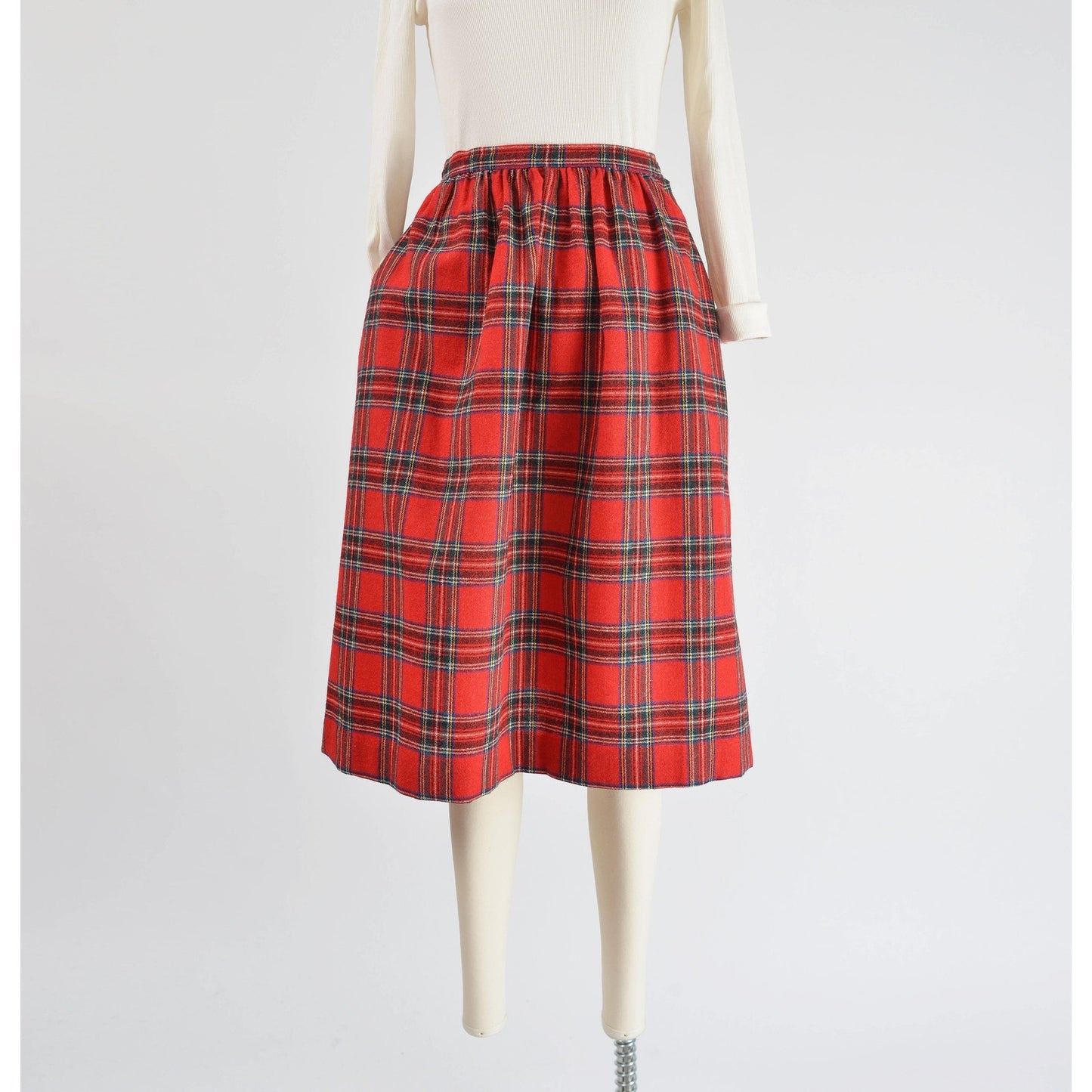 Full front view of Vintage 1970s red tartan plaid full wool midi skirt.