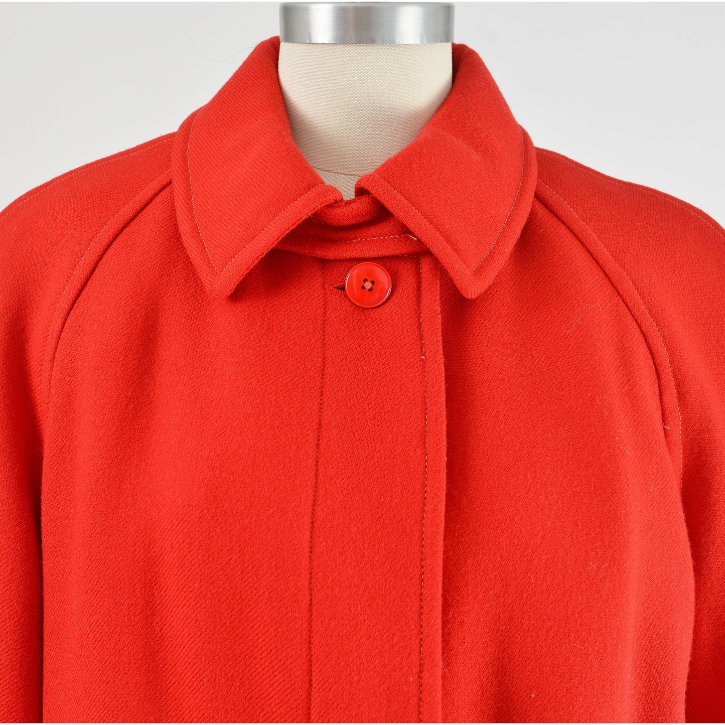 Close up view of neckline on vintage 80s red wool long full length winter coat.