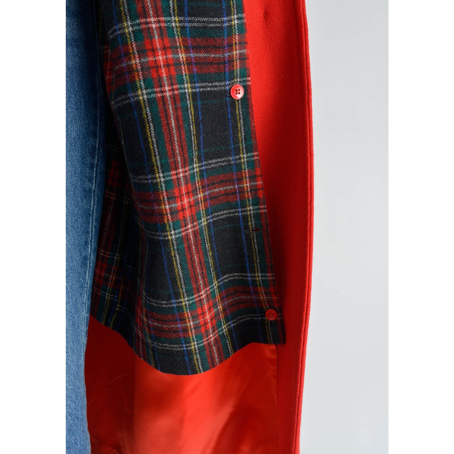 View of plaid liner on vintage 80s red wool long full length winter coat.