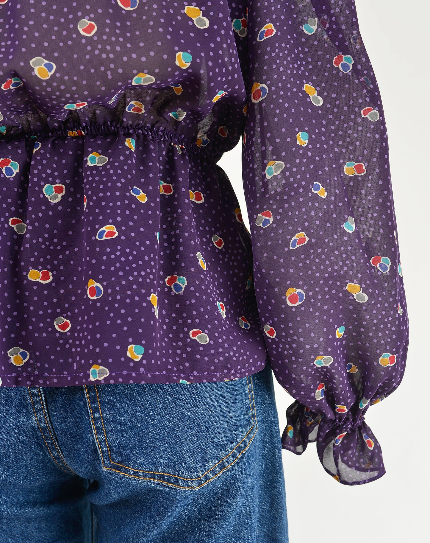 Vintage 80s sheer purple polka dot peplum waist tie neck blouse.