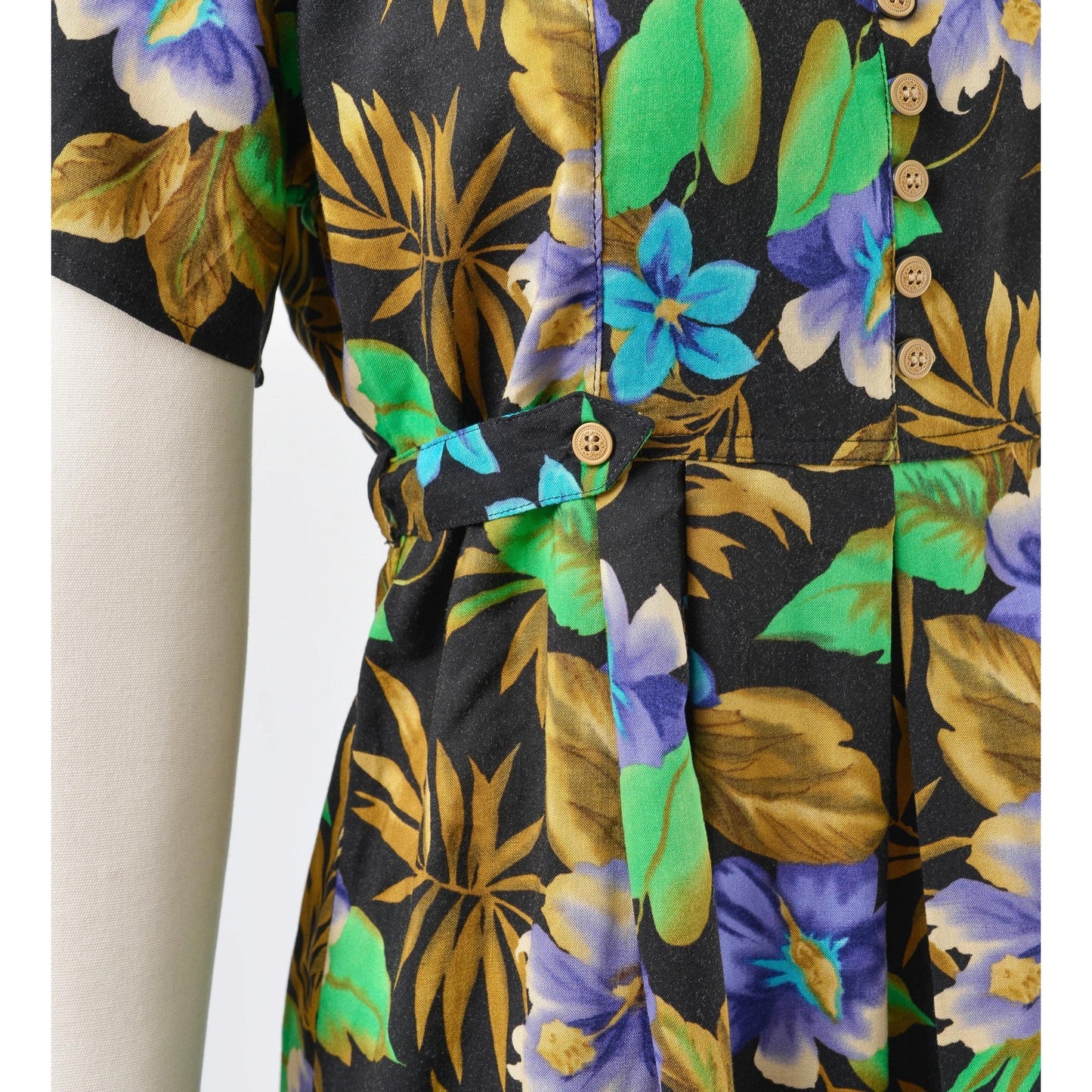 Close up view of waistline on 90's floral Hawaiian print dress.