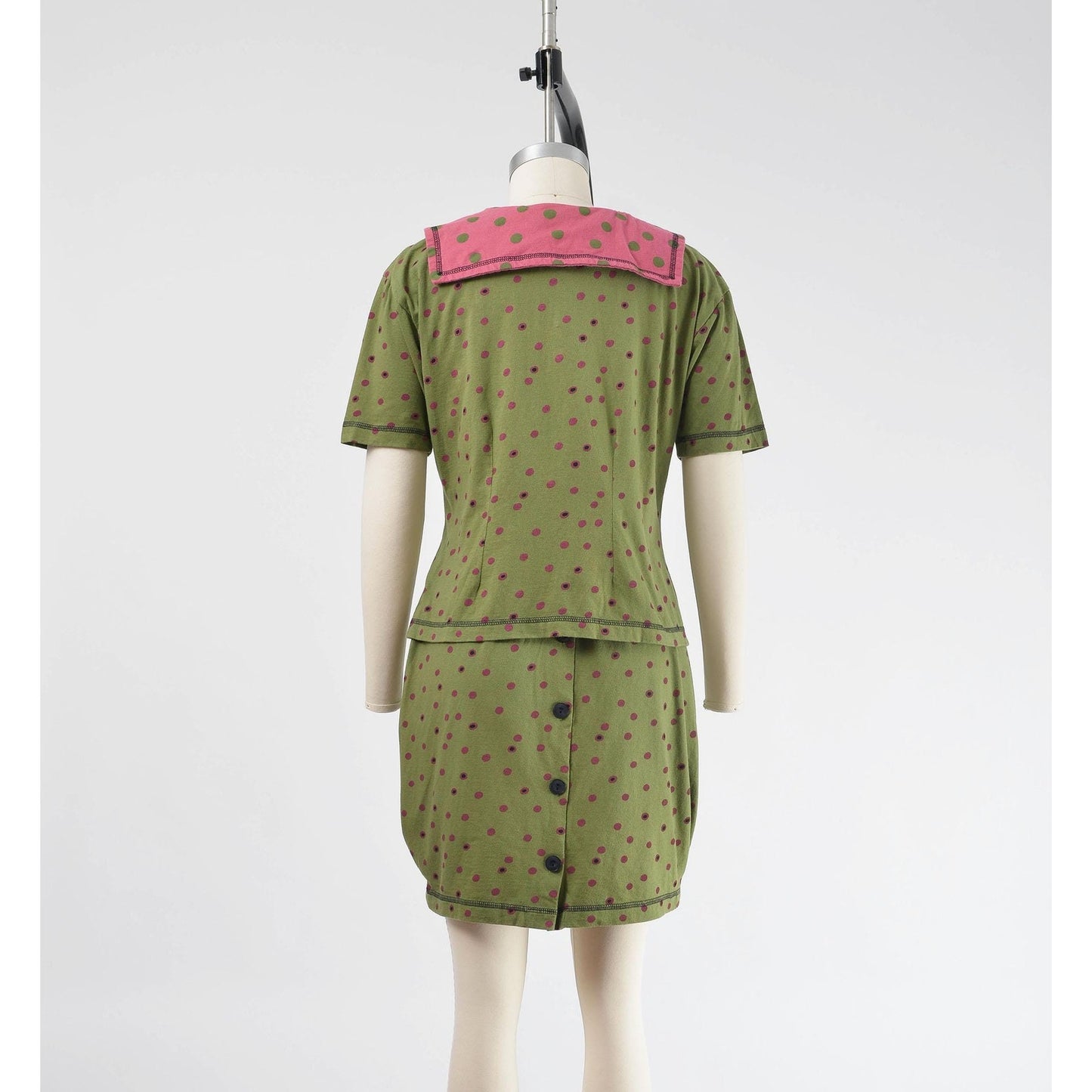Back view of vintage 1990s green polka dot sailor collar top and pencil skirt set.