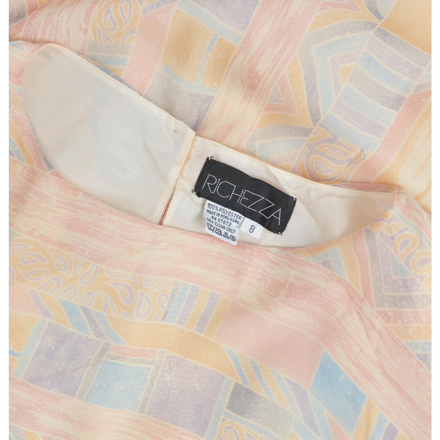 View of Richezza label inside of dress neckline. 