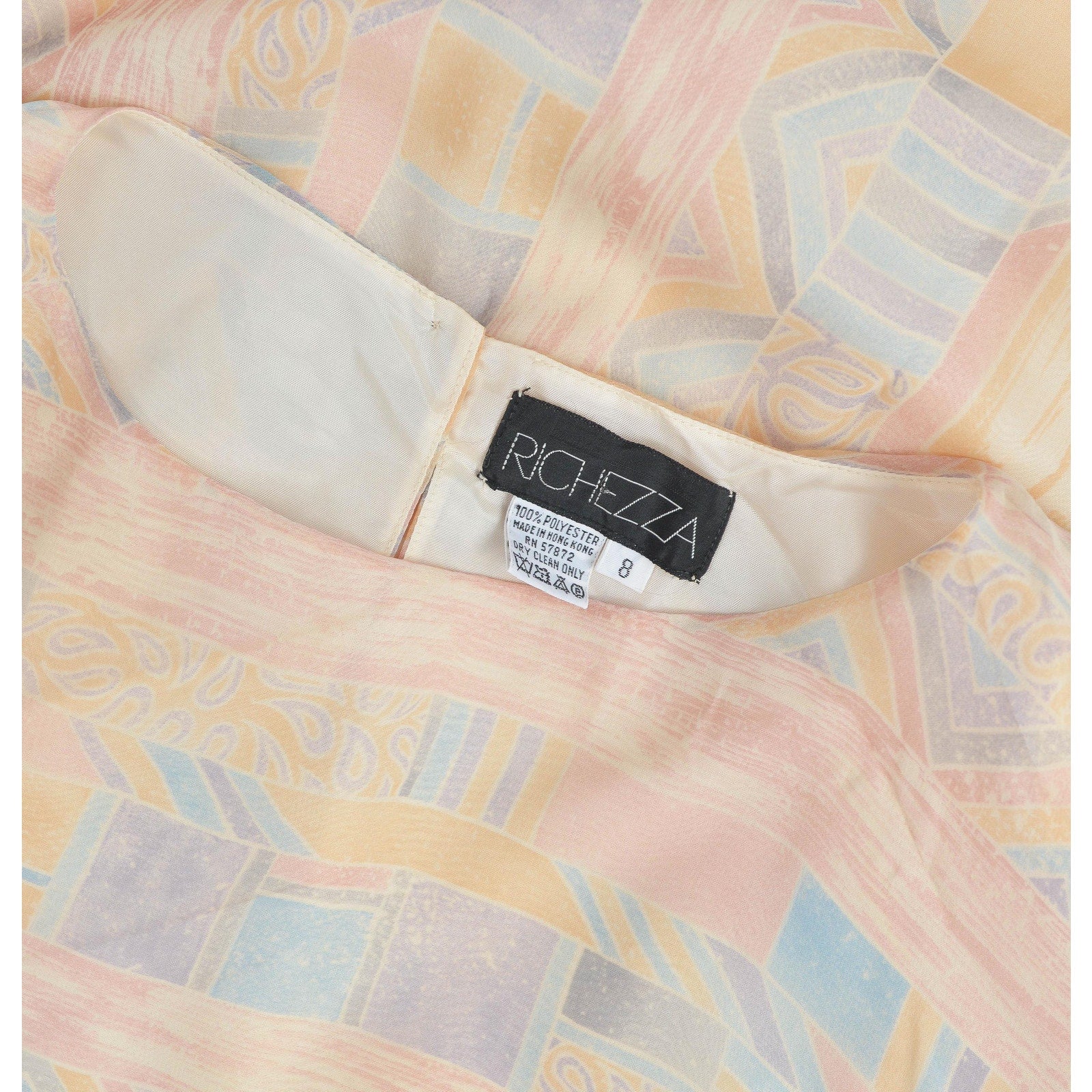 View of Richezza label inside of dress neckline. 