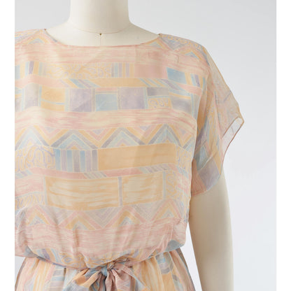 Close up view of fabric on Vintage 70s pastel geometric sheer chiffon blouson midi dress with tie belt. 