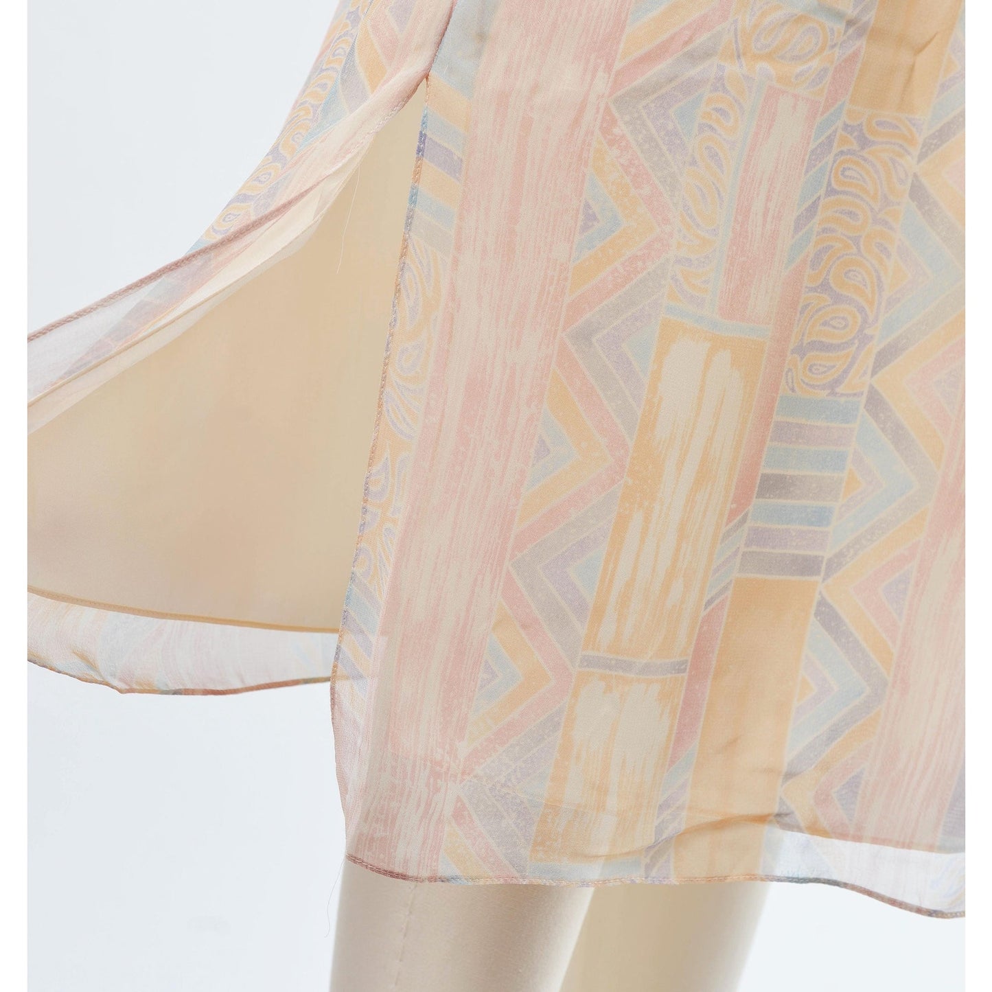 View of slit on the vintage 70s pastel geometric sheer chiffon blouson midi dress with tie belt. 