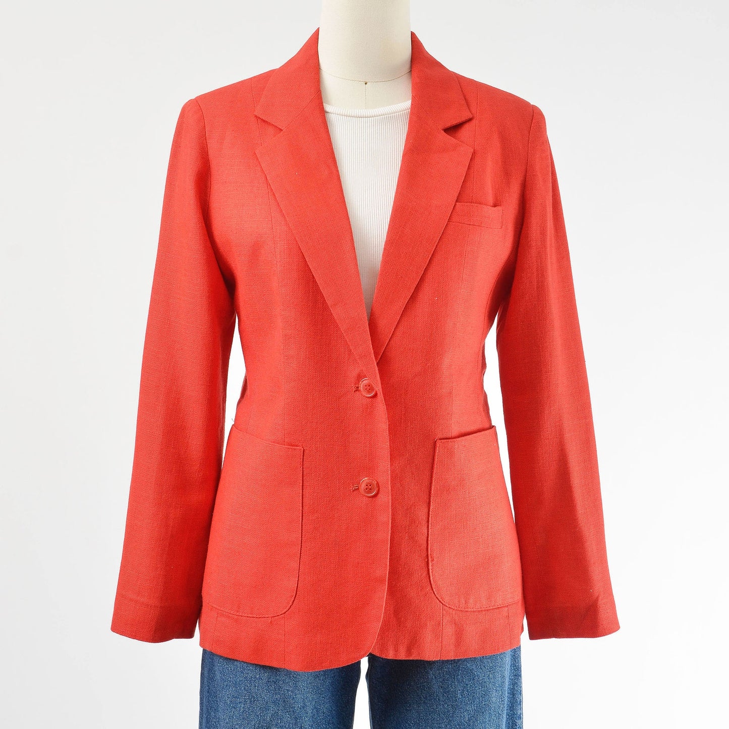 Vintage 1970s red linen and rayon blend blazer. Fitted silhouette. Two button closures with large hip pockets. 