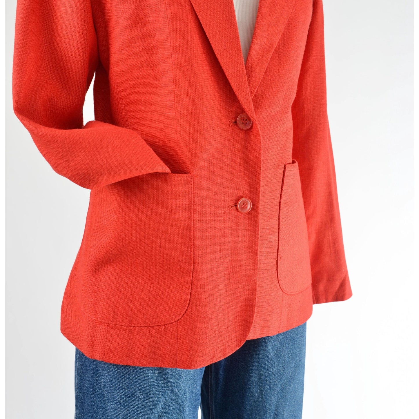 Vintage 1970s red linen and rayon blend blazer. Fitted silhouette. Two button closures with large hip pockets. 