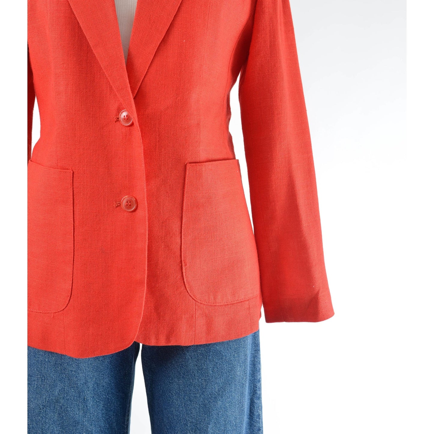 Vintage 1970s red linen and rayon blend blazer. Fitted silhouette. Two button closures with large hip pockets. 