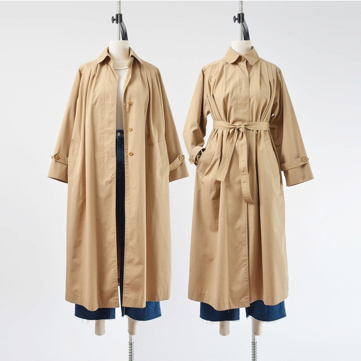 Two side by side views of a vintage 1970's tan trench coat with tie belt. 