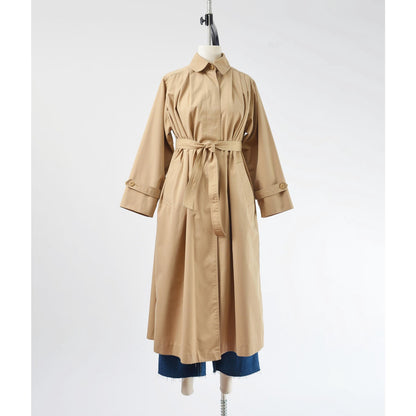 Belted full frontal view of a vintage 1970's tan trench coat. 