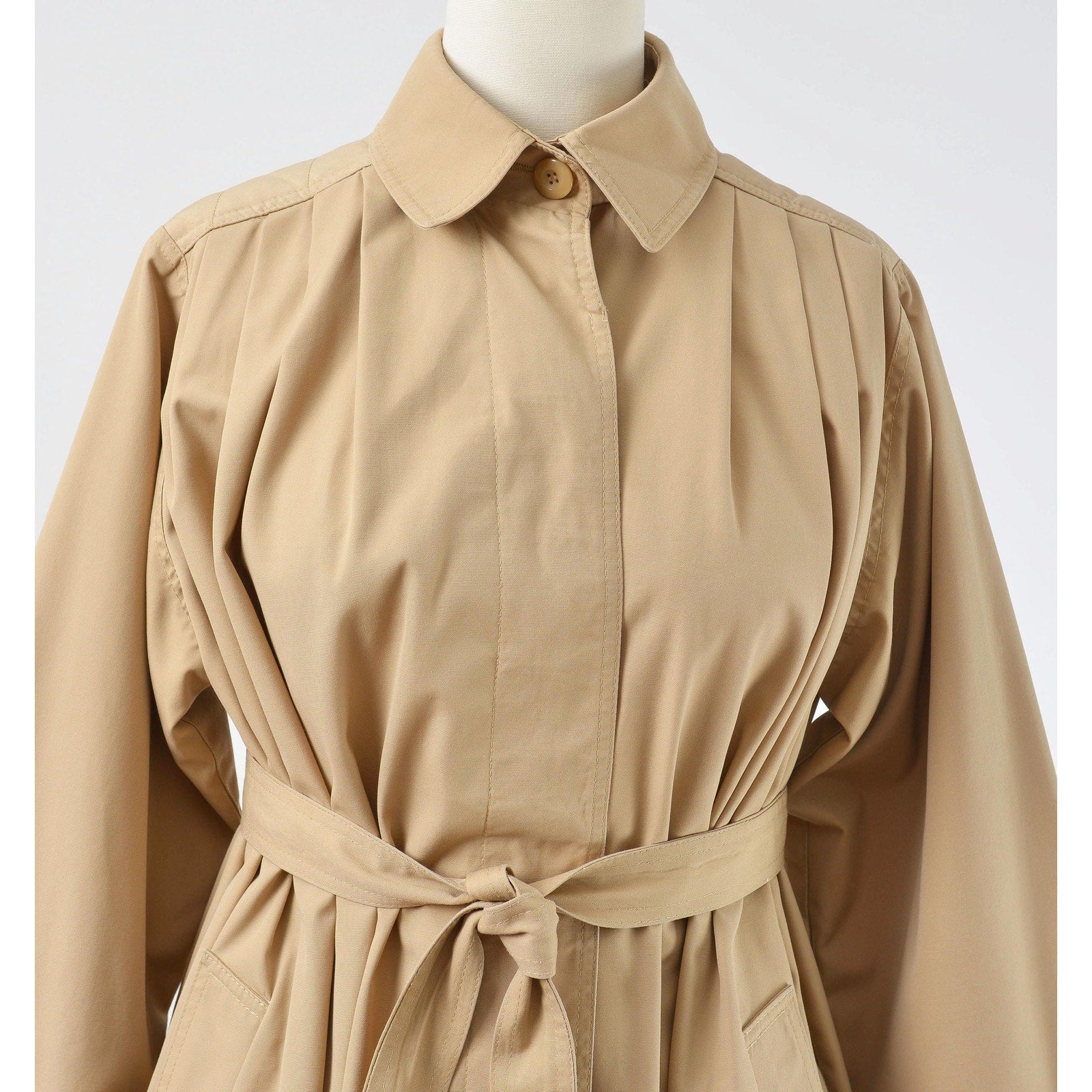 Close up view of collar on a vintage 1970's tan trench coat. 