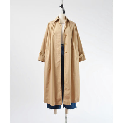 Full unbutton view of a 1970's tan trench coat.