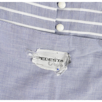 Pedestal label inside of vintage dress. 