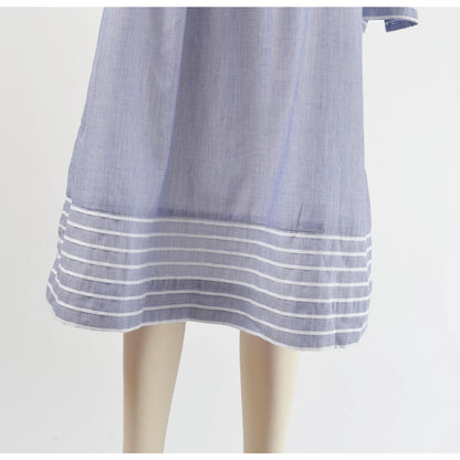 View of hemline on 80s blue and white striped cotton tent dress with puff sleeves. Front view.  