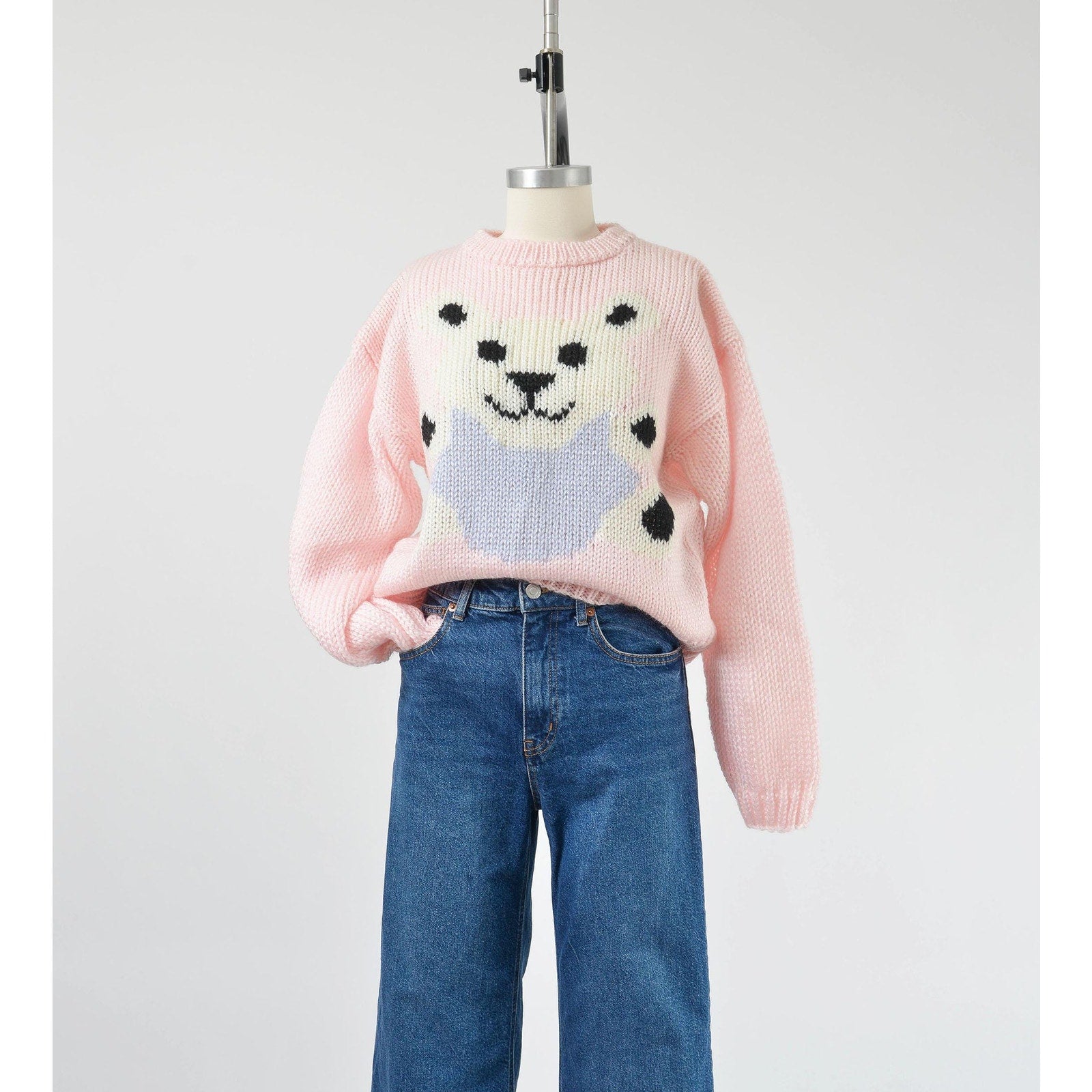 Vintage 1980s kawaii pink teddy bear sweater. Chunky acrylic knit. Tucked into a pair of jeans