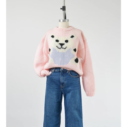 Vintage 1980s kawaii pink teddy bear sweater. Chunky acrylic knit. Tucked into a pair of jeans