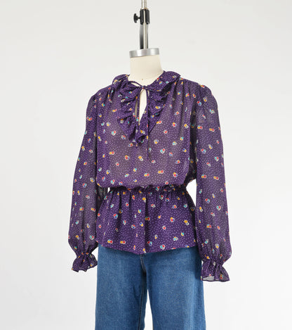 Vintage 80s sheer purple polka dot peplum waist tie neck blouse. 