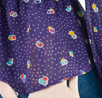 Vintage 80s sheer purple polka dot peplum waist tie neck blouse. 