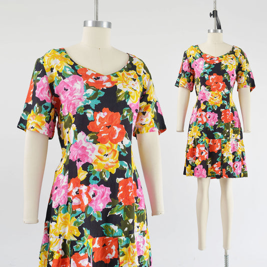 Vintage 90s colorful floral print dress. Sheath silhouette with pleated hem.