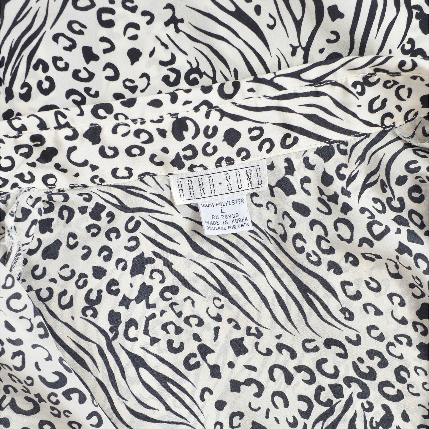 Vintage 1990s black and white leopard animal print button down blouse. 