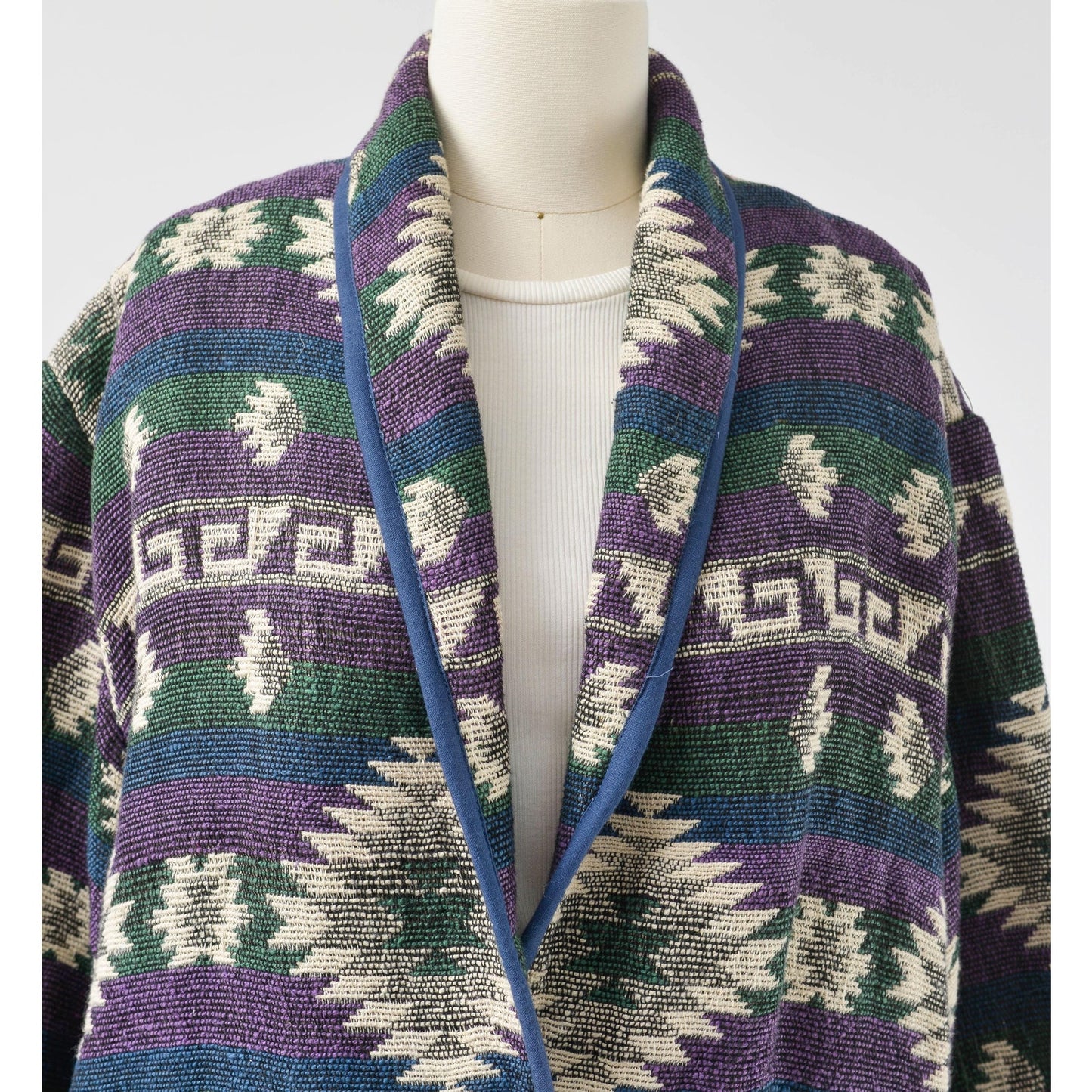 View of collar on woven southwestern jacket. 