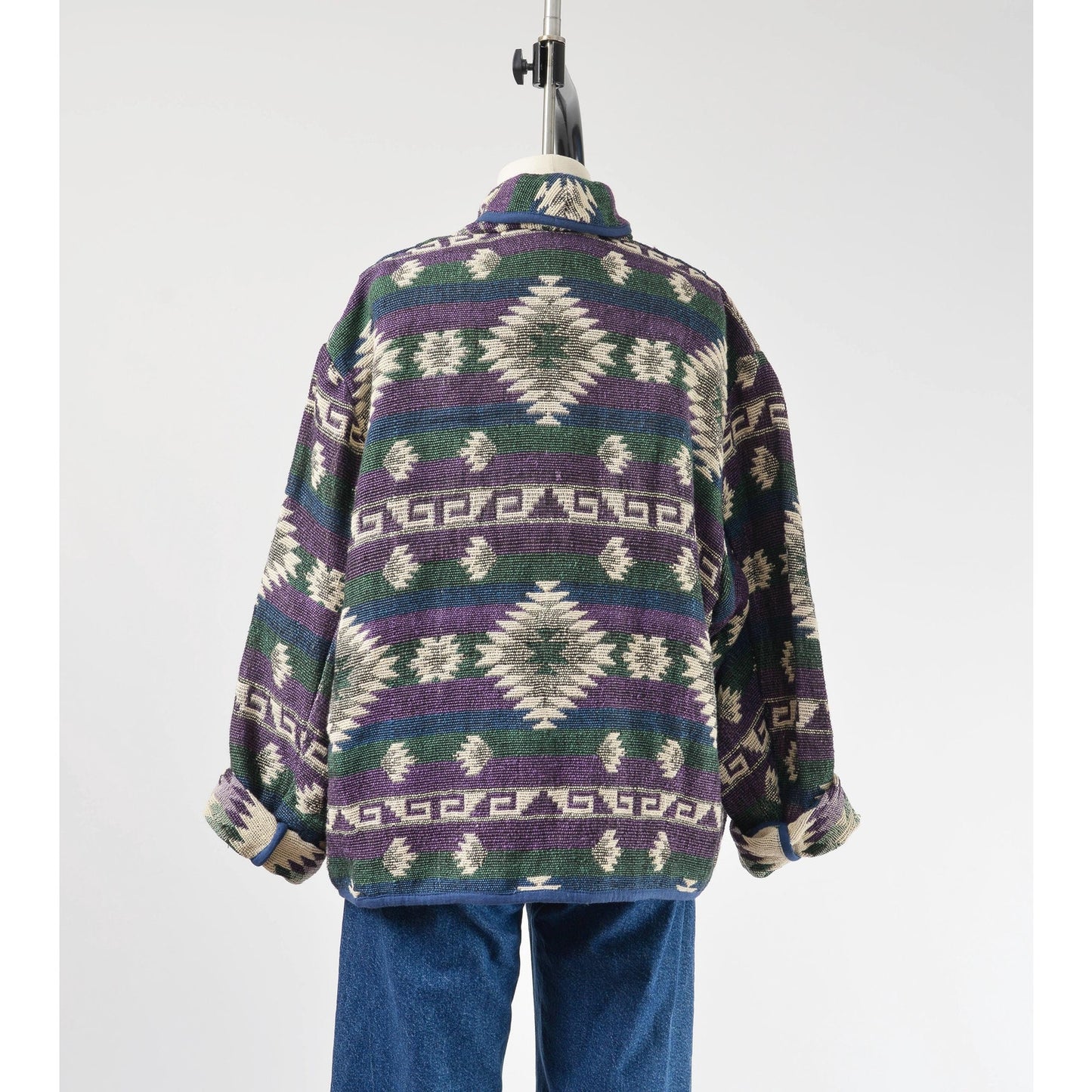 Back view of woven southwestern jacket.