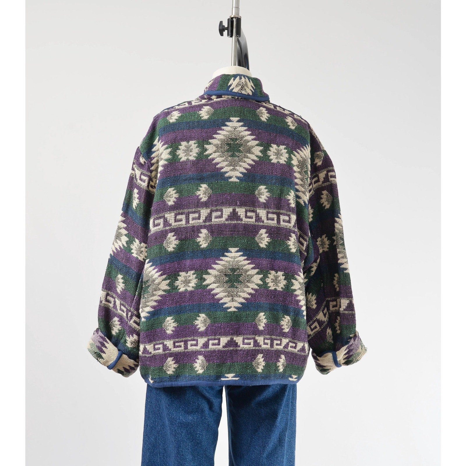 Back view of woven southwestern jacket.