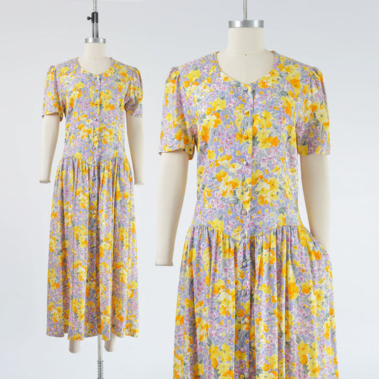 Vintage 90s yellow and purple floral dress. Dropped waist with side pockets. Maxi length.