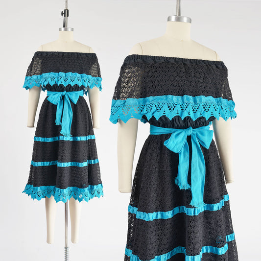 Vintage 80s black and blue sheer lace dress with off shoulder neckline.